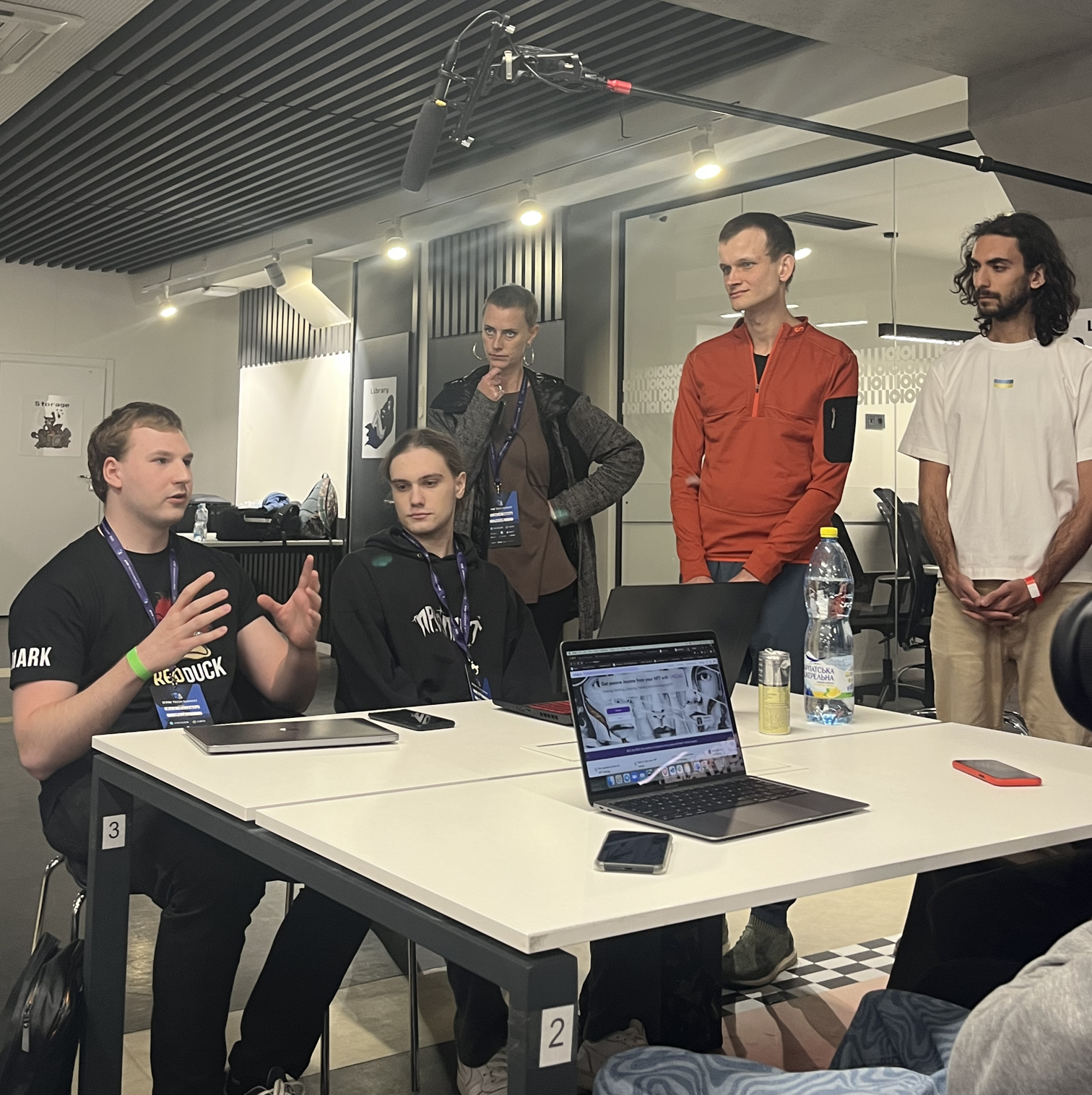 Mark and Vitalik Buterin discussing blockchain